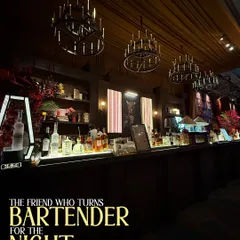 This classic, speakeasy style bar setup features dark wood, warm chandelier lighting, and a fully stocked back bar. It creates a sophisticated and timeless atmosphere for any cocktail event.