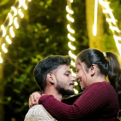 A change of outfits for a night shoot. The warm tones of their sweaters and the romantic lighting create a cozy and intimate feel.