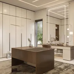 A bright and airy dressing room with off-white, floor-to-ceiling wardrobes and a large central island. The design includes a separate vanity desk with a unique, modern light fixture.
