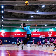 This is what we train for: the peak moment of a championship match. Here, one of our athletes executes a powerful spike, showcasing the technique, timing, and confidence we build at the academy.