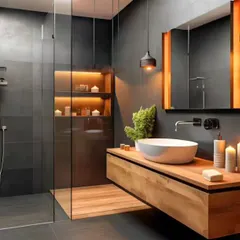 This bathroom vanity has a spa-like feel, with a floating wood counter, a vessel sink, and warm backlighting behind the mirror. The open shelf below is perfect for towels and decor.