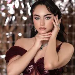 This portrait was for a makeup course, focusing on a glamorous evening look. The shiny, reflective background complements the sequined dress and diamond jewelry, creating a party-ready vibe.