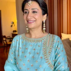 A close up of this mother of the groom's radiant look. The makeup is soft and flattering, designed to look beautiful both in person and in photographs.