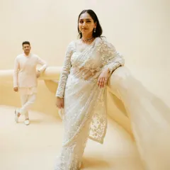 An elegant portrait featuring a stunning white embroidered saree. I used the minimalist, curved architecture and soft lighting to create a look that is both modern and timelessly graceful.