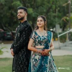 This series of photos captures a stylish couple during their Sangeet. From a romantic forehead kiss to playful poses, these shots showcase their beautiful coordinated outfits and happy connection.