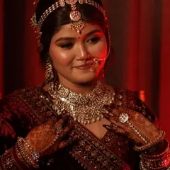 This image showcases the complete look with intricate jewellery and henna. My work ensures the makeup harmonizes with all other elements, creating a cohesive and stunning visual for any traditional-themed project.