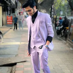 The slim fit and unique color of this lavender suit make it a standout piece for any fashion-forward groom or guest.