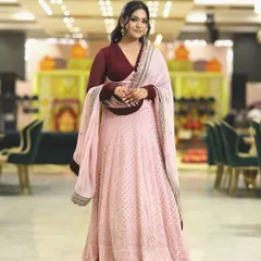 For special occasions, I love embracing timeless elegance. This beautiful pink lehenga with a contrasting maroon blouse was my choice for a family celebration. The focus is on a flattering silhouette and delicate embroidery.