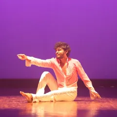 An expressive moment from a contemporary solo performance. Our training encourages dancers to connect with the music and convey emotion through their movements.