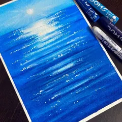 An ocean scene created with just a few shades of blue and white oil pastels. This piece is all about capturing the reflection of the sun on the water's surface.