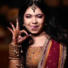 A fun and playful portrait of a bride. Her quirky expression shows her fun-loving personality, proving that bridal photos can be both beautiful and full of character.