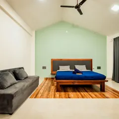 A clean, modern, and spacious room at a hostel in Chikmagalur. I ensure that even budget-friendly options are comfortable and well-designed, providing a great base for your adventures in the hills.