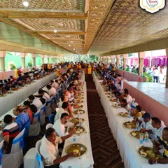 Long-table seating arrangements are perfect for large community feasts. We manage the entire setup to ensure every guest is served efficiently.