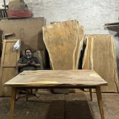 Me in my element, surrounded by massive slabs of live-edge wood. I personally select the timber for each project to ensure the best quality and character.