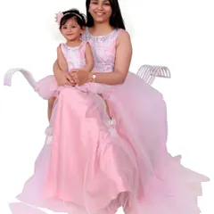 A special mother-daughter portrait session featuring matching pink gowns. I offer coordinated outfits to create a unique and adorable memory for you and your child.