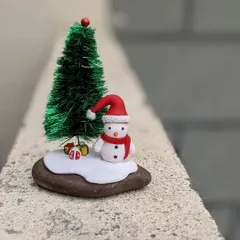 "Let the snowflake sparkle begin!" This handmade snowman miniature is ready to spread holiday cheer. It's a perfect unique gift for the Christmas season.