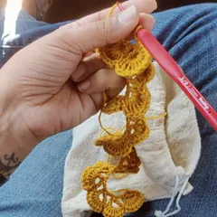 Another angle of my travel project. The simple act of creating loops with a hook and thread is so calming, especially when you're on the move.