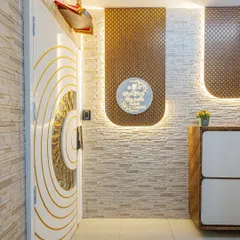 This is the full view of a grand entrance I created. The design includes the custom main door, a backlit nameplate, textured wall panels, and a sleek shoe cabinet, all working together to make a strong first impression.