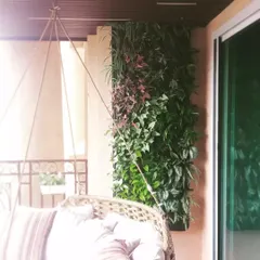 A perfect spot to relax. We installed this bio-wall on a client's balcony next to their swing, creating a private, green sanctuary that makes the space feel like a peaceful retreat.