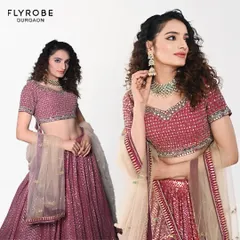 Rent the elegance, own the moment. This client looks stunning in a sequined mauve lehenga, proving you don't need to buy to look your best.