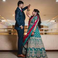 For a reception, we can create a more glamorous and contemporary look. Here, I styled the bride with a sophisticated updo and bolder makeup to complement her ornate lehenga, ensuring she looked stunning for her evening celebration with her partner.