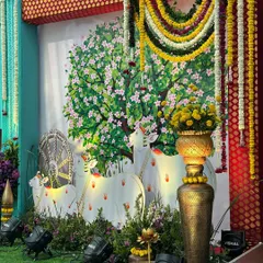 Another backdrop from our Vrindavan theme, depicting sacred cows under a blossoming tree, with garlands of fresh flowers hanging at the sides.