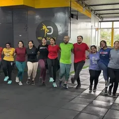 Our Zumba class practicing a coordinated dance-fitness routine. It's a fun way to improve coordination and cardiovascular health.