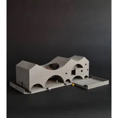 This 3D-printed model of "The Arcades Project" demonstrates our process of reinterpreting familiar forms like arches and pitched roofs. The design for this community center uses these elements to create a porous, light-filled volume that engages with its neighborhood.