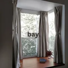 We turned this corner into a cozy bay window seat. It's the perfect spot to curl up with a book and enjoy the view, demonstrating how we can carve out charming, usable spaces in any home.