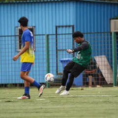 Our goalkeeper confidently plays the ball out from the back, initiating an attack as part of our build-up play.