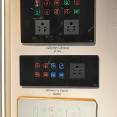 A display of various smart touch panels available at our exhibition stall. This image shows different configurations, including models with 10 switches and 2 sockets, or 8 switches and 1 socket.