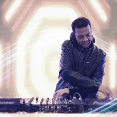 A creative shot of me at the console. I believe a great DJ makes people happy, and seeing the joy on their faces when they hear a song they love is the best feeling.