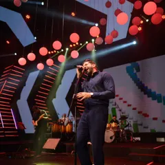 The charismatic Farhan Akhtar energizing the crowd at one of our events. We manage everything from artist booking to stage production for a seamless, high-impact show.