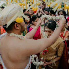 The garland exchange, or Jaimala, is the moment two souls are tied together. I focused on this intimate action, surrounded by family and flowers, to capture the sacredness of the union.