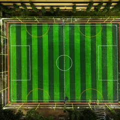 An aerial view of our pristine, floodlit football turf in JP Nagar. This is the perfect pitch for your 5v5 or 7v7 matches, day or night. The professional-grade turf is ready for your crew's next big game.
