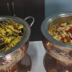 Our continental appetizers, featuring chicken satay skewers and a grilled chicken salad. We offer a diverse menu to cater to different tastes.