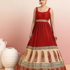 The full silhouette of the red and beige gown is both majestic and graceful, making it a perfect choice for a wedding reception or cultural event.