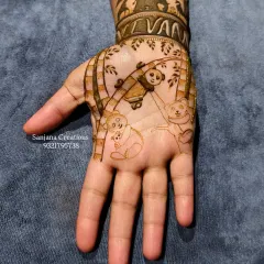 Here's a detailed look at the panda-themed hand from the baby shower set. The baby's name, 'Vivaan', is beautifully integrated into the wristband design.