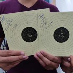 A perfect 100/100 series from our student Rishabh. This close-up shows the tight grouping of shots, a key indicator of a stable and consistent shooting technique.