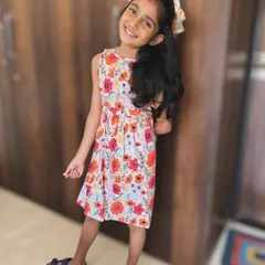 A perfect dress for a sunny day. This floral frock has a beautiful open back with yellow lace trim, making it feel so light and airy. The print is vibrant and full of joy.