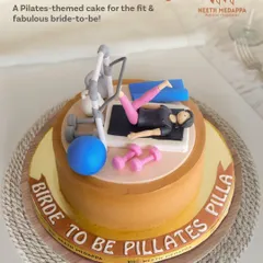 Bride in training! This Pilates-themed cake was for a fit and fabulous bride-to-be, complete with a reformer machine, weights, and a yoga mat.