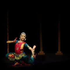 A challenging pose requiring balance and flexibility, performed at the Kanasu Dance Event. The vibrant blue and pink costume was for this particular recital.