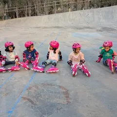 Taking a well-deserved break! This adorable group of skaters in matching pink gear shows that learning a new skill takes perseverance. We teach our students that practice and consistency are the keys to success.