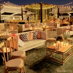 This sangeet was designed for presence, not just performance. We used vintage-style seating, hundreds of candles, and a warm, neutral palette to create quiet corners for laughter and conversation, letting the people and their connections shine.