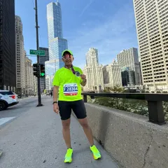 My client standing proud in the streets of Chicago after his marathon. Seeing athletes I coach achieve their dreams, especially on a world stage, is the most rewarding part of my job.