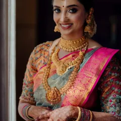 A happy bride, ready for her Muhurtham. I used warm tones and a soft focus on the eyes to complement her beautiful gold jewellery and colourful Kanchipuram saree.