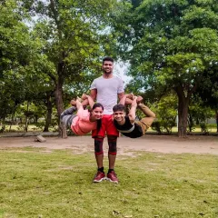 Another creative three person acro yoga pose. We love experimenting with different shapes and balances in the park. It’s a practice that combines strength, flexibility, and friendship.