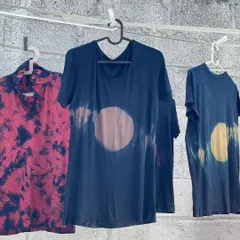 A collection of t-shirts dyed with natural indigo and other pigments, showcasing different tie-dye and resist techniques. These were created for a local carnival where we also hosted hands-on workshops.