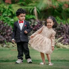 A dapper little gentleman and a sparkling little lady make an adorable pair. We love capturing kids in their finest outfits for special occasion photoshoots.