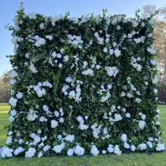 This fresh and natural-looking foliage wall, dotted with white blossoms, is perfect for bringing the beauty of a garden to any event, indoors or out.